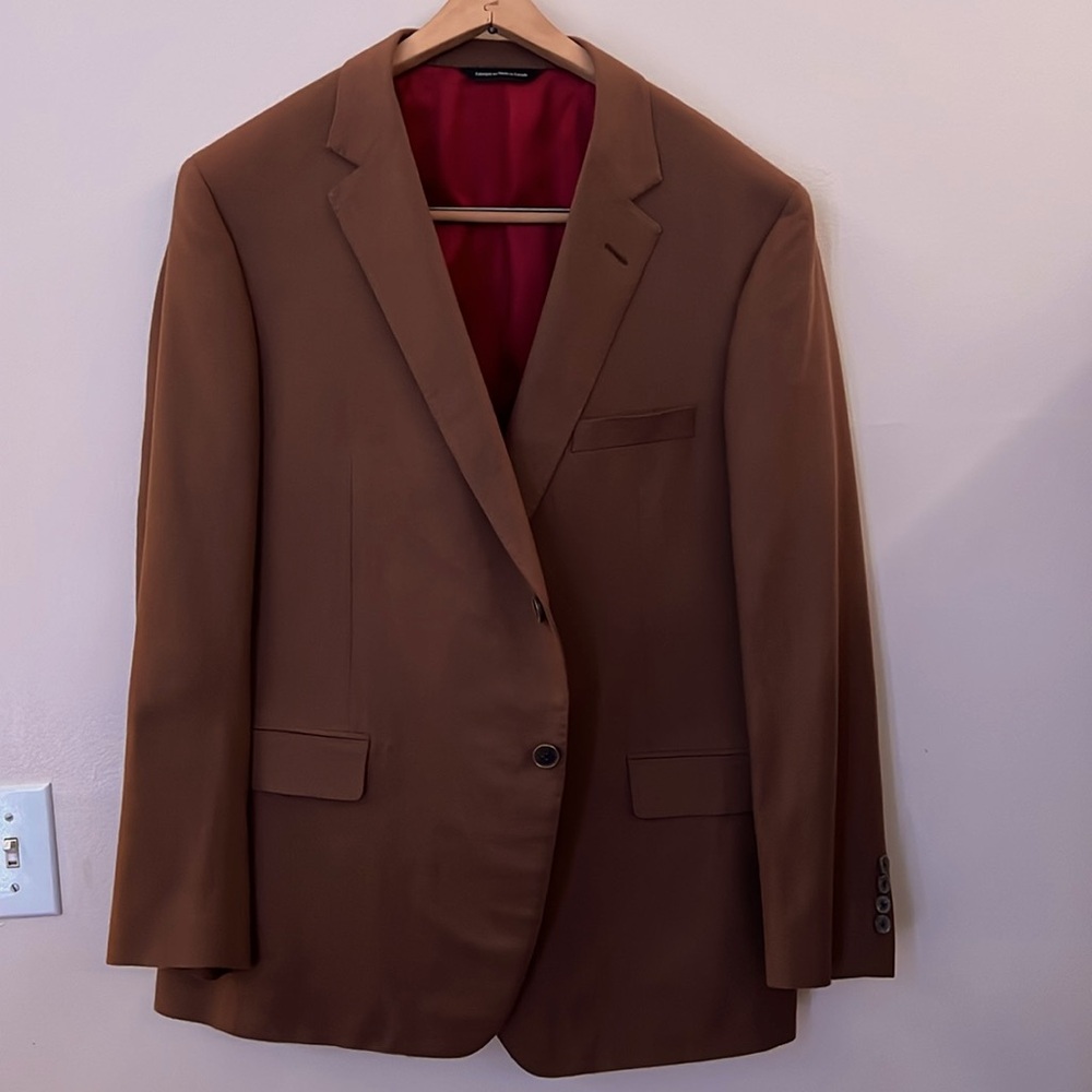 Brown camel hair exterior with a red interior. Brand: Loro Piana.